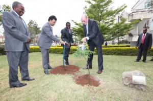Dr Frank Stagenberg planting a tree at UoN