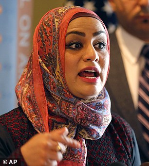 Muslim chaplain Tahera Ahmad responds to a question during a news conference Wednesday, June 3, 2015, in Chicago. A Shuttle America flight attendant "will no longer serve United customers" following an investigation into the Muslim chaplain's complaint of discriminatory treatment during a flight last week, an airline spokesman said Wednesday. Ahmad said a flight attendant declined her request for an unopened can of Diet Coke because it could be used as a weapon. The flight was operated by Shuttle America for United. (AP Photo/Christian K. Lee)