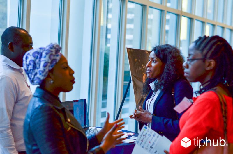 Startups chat with attendees during Diaspora Demo Day Expo hall